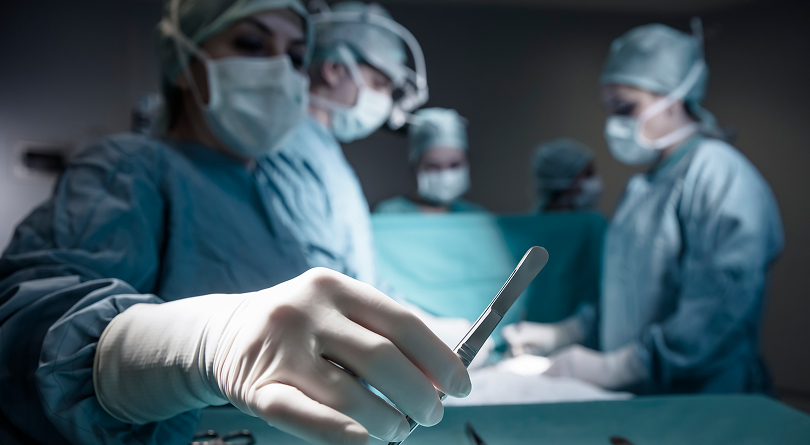 group of doctors doing surgery
